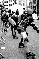The players line up before the start of a roller derby match