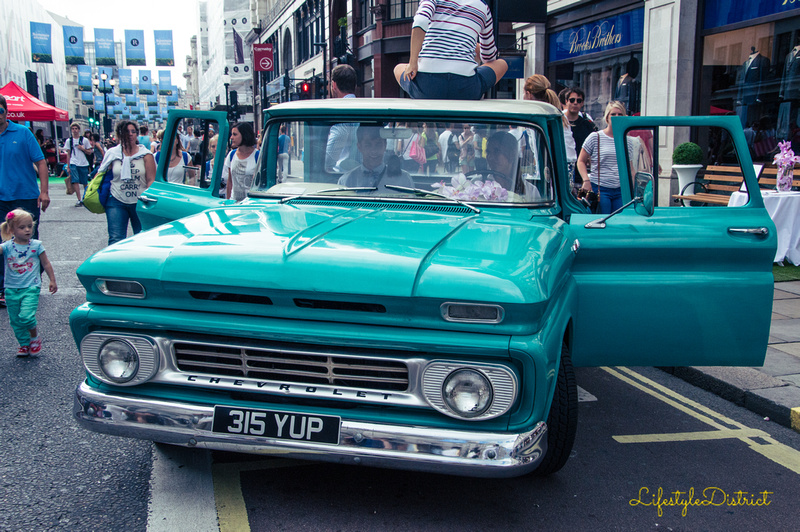 A vintage Chevrolet parked in the middle of Regent street during traffic free Sundays