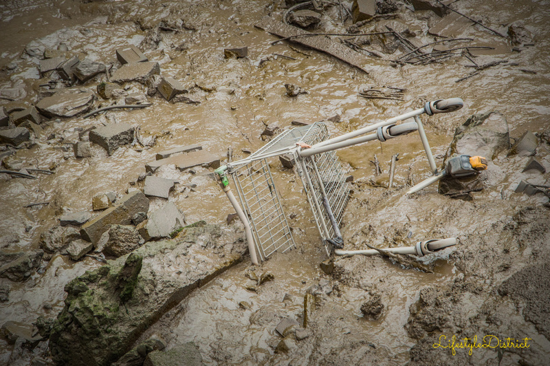 A shopping trolley slowly sinking in the mud