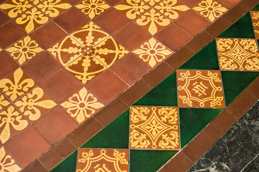 Orange and yellow tiles ornate the floor at the Cathedral