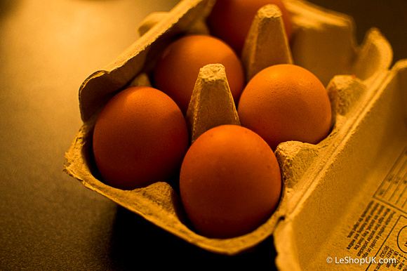 Eggs in a box under a lovely golden light