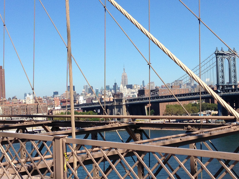 You get an amazing view of the Empire State Building from the Brooklyn Bridge in New York. 