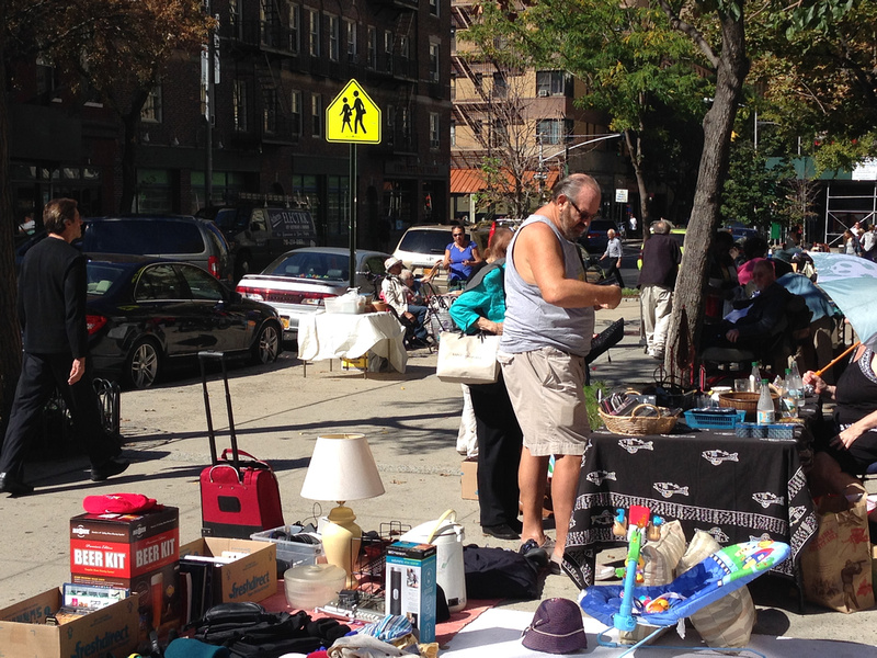Customers browsing the stalls at a Saturday flea market in Brooklyn Heights, New York City. 