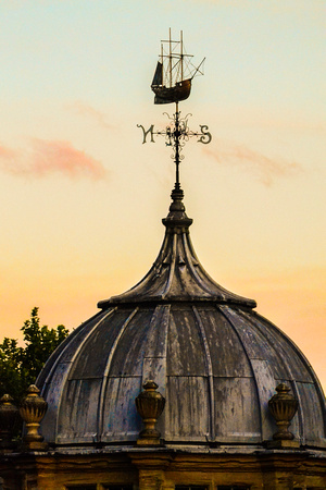 A weathervane against an evening sky in Bristol