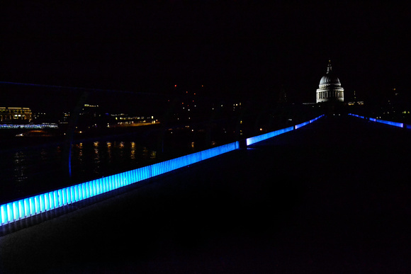 walking across Millennium Bridge in a deserted London