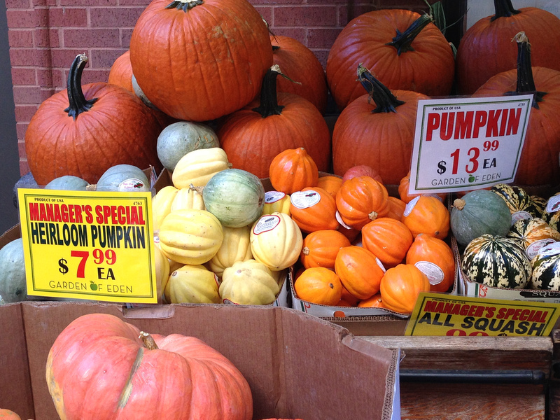 Juicy pumpkins ready for Halloween outside Garden of Eden grocery store on Montague Street in Brooklyn Heights in New York City.